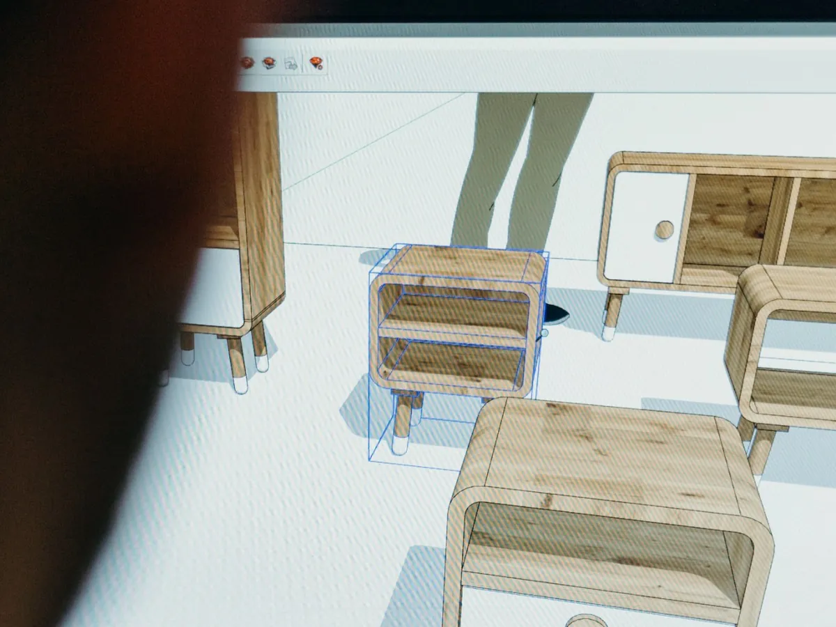Pantalla de computadora con un modelo 3D de muebles de madera, mesas de luz y un rack con patas, en un programa de modelado